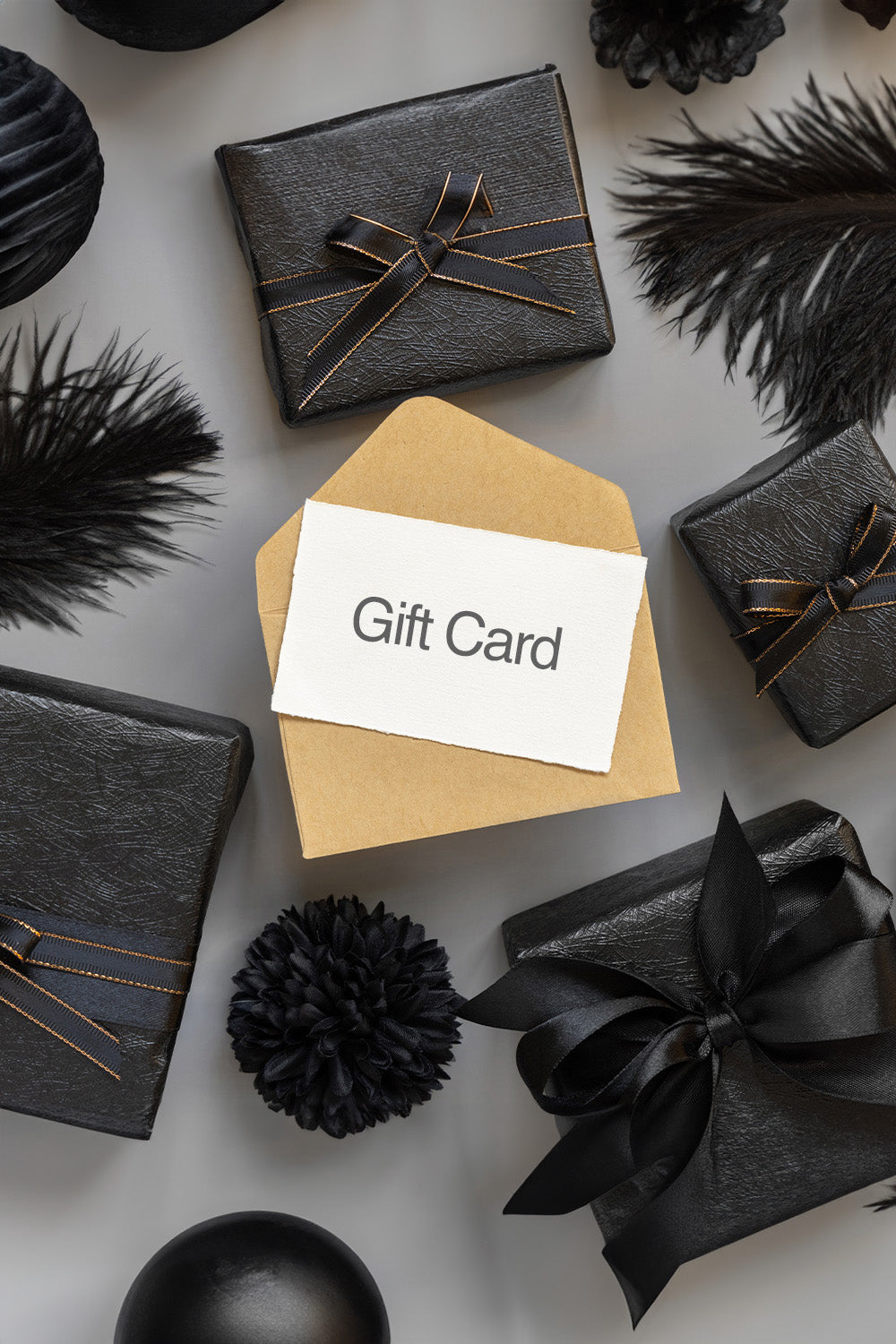 Stylish ACQUO of Sweden gift card in a kraft envelope, surrounded by elegant black gift boxes with satin bows—perfect for luxury boot lovers and fashion-forward gifting