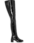 Side view of ACQUO of Sweden's signature knee-high black rubber boot with a stylish block heel and sleek finish – Scandinavian fashion meets timeless design