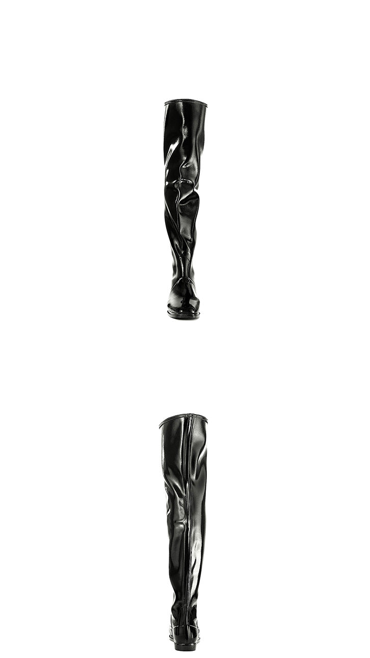 Front and back views of ACQUO of Sweden's signature over the knee black boots in high-shine natural rubber, featuring a sleek, sculpted silhouette with flat sole for timeless elegance and comfort