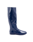 Svea Iris Blue side view by ACQUO of Sweden featuring elegant iris blue knee-high rubber boots with a sleek silhouette and flat sole