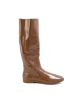 Svea Walnut Brown side view of ACQUO of Sweden shiny rubber boots with a classic silhouette and flat sole.