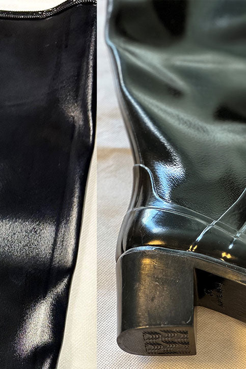 Close-up of ACQUO of Sweden black rubber boot surface with visible creases and uneven texture on the shaft and heel