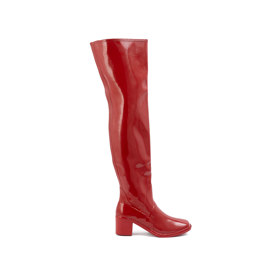 Lisa Cherry Red side view of ACQUO of Sweden shiny rubber boots with a slim silhouette and block heel.