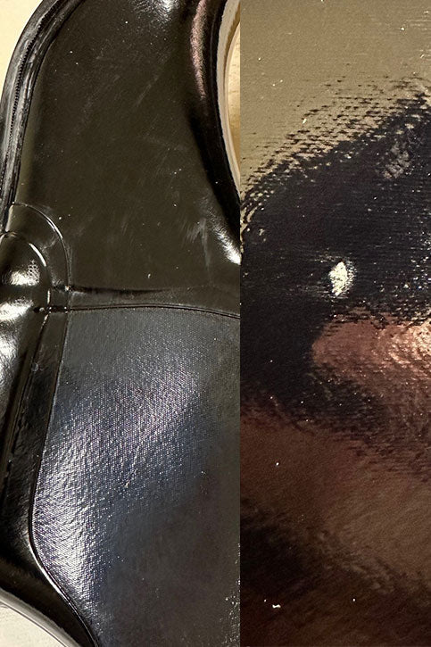 Close-up of ACQUO of Sweden’s signature high-gloss black rubber boots, highlighting minor surface markings on the heel and a visible flaw on the toe — showcasing the handcrafted nature and unique finish of each pair