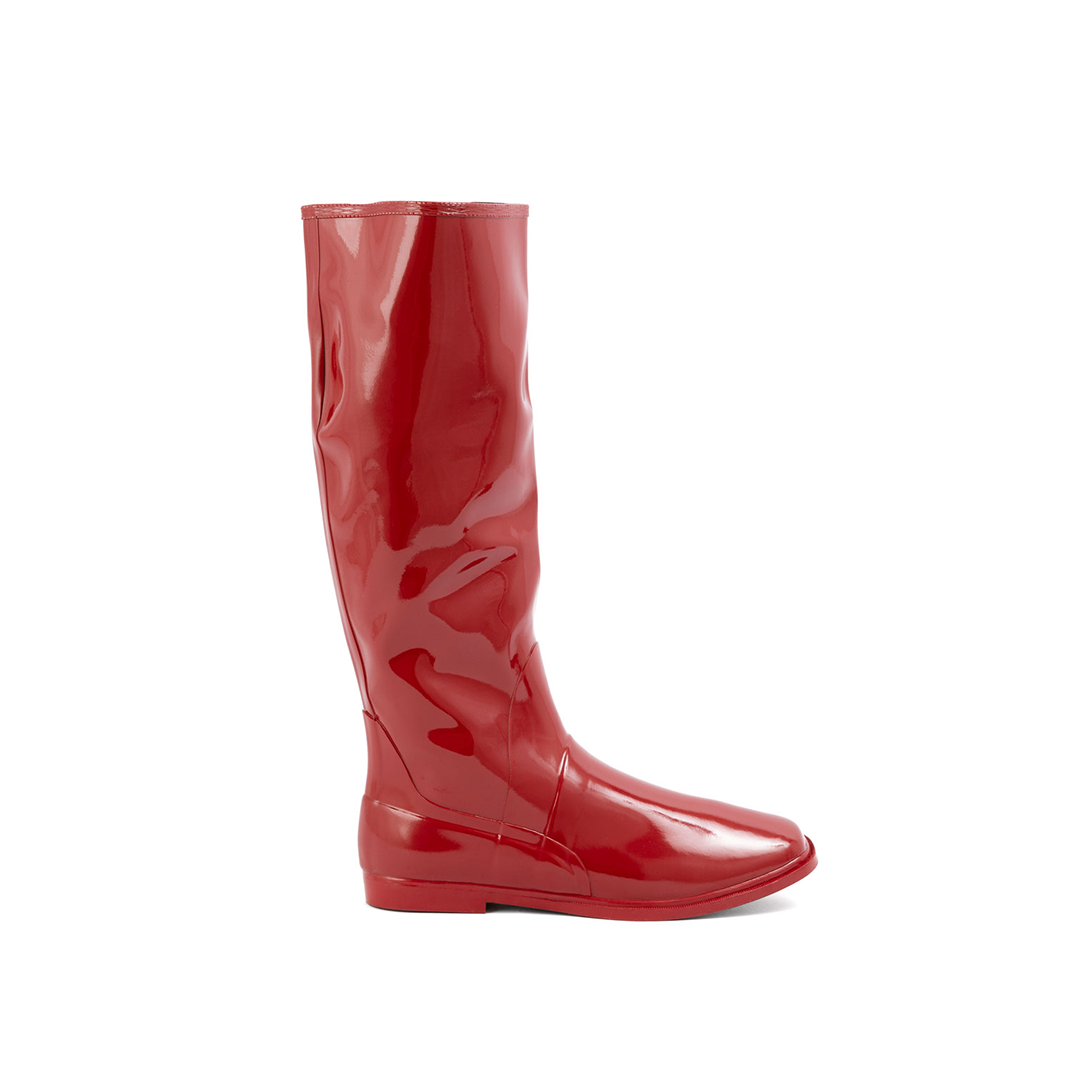 Svea Cherry Red side view of ACQUO of Sweden shiny rubber boots with a classic silhouette and flat sole.